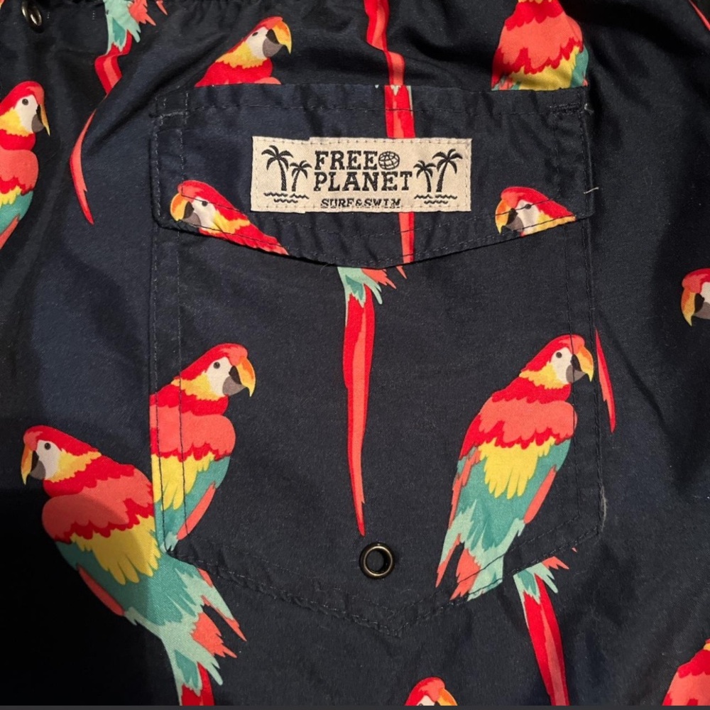 Free Planet Navy Swim Shorts with Red, Yellow and Teal Parrot Print